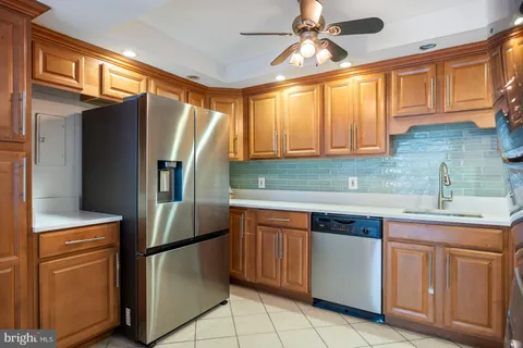 a kitchen with a stove top oven sink and cabinets