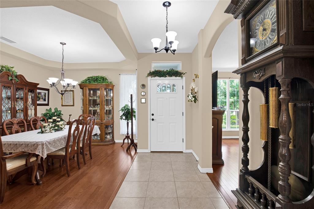 16411 Southwest 14th Avenue Road Ocala, FL 34473 - Photo 3 of 59 a view of a dining room with furniture window and wooden floor