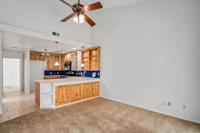 a view of a kitchen with a sink