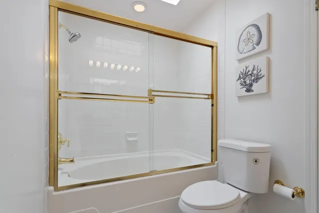 a bathroom with a shower and a toilet