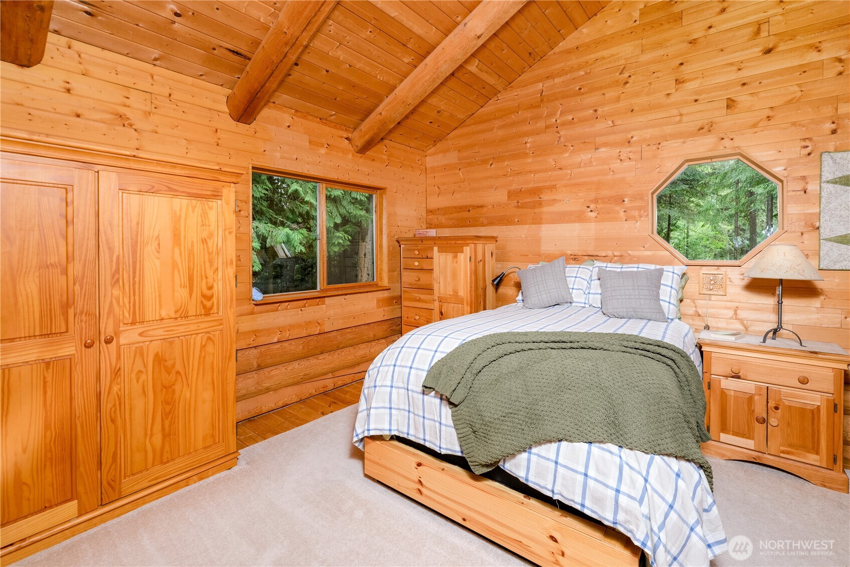 214 Cougar Crest Road Sequim, WA 98382 - Photo 16 of 30 a bedroom with a bed and a window