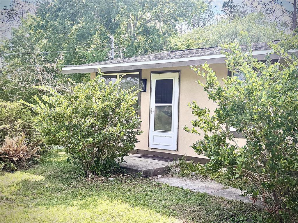375 Pine Woods Road Ormond Beach, FL 32174 - Photo 2 of 16 a view of a house with a yard