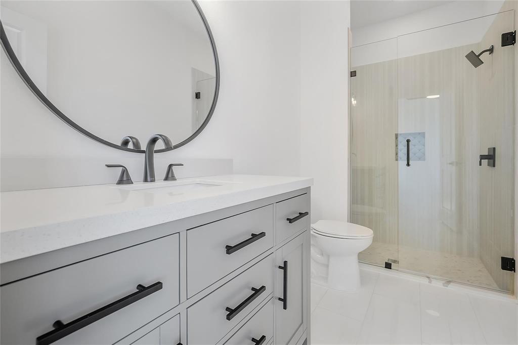 3093 Willow Road Celeste, TX 75423 - Photo 33 of 40 a bathroom with a sink a toilet and shower