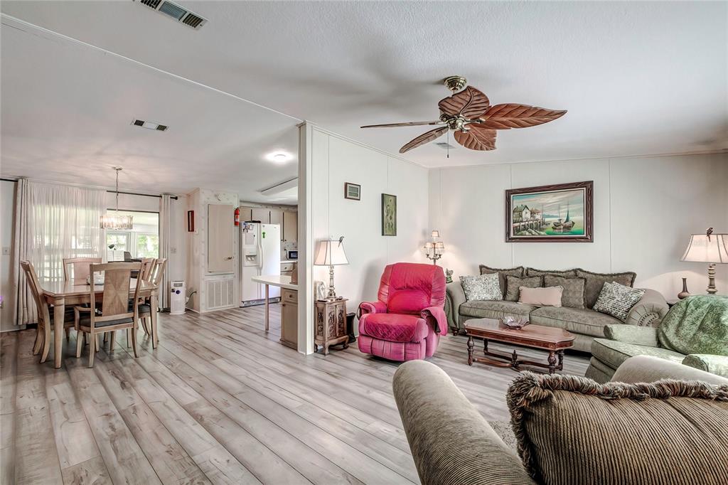 3307 Keye Drive Spring Hill, FL 34606 - Photo 13 of 29 a living room with furniture and wooden floor
