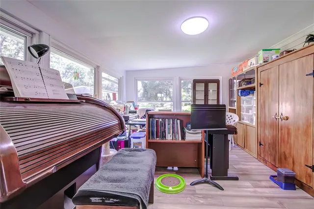 a bedroom with furniture and a wooden floor