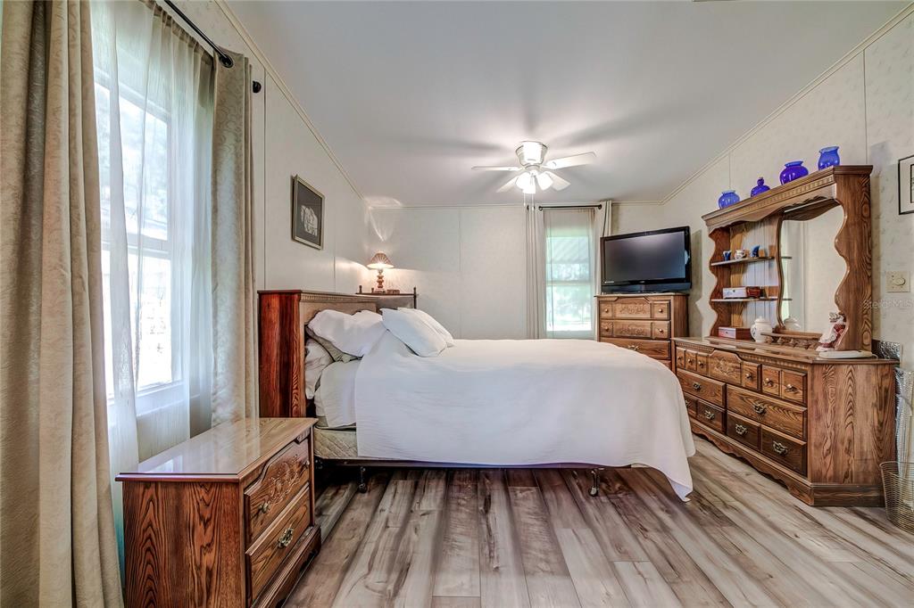 3307 Keye Drive Spring Hill, FL 34606 - Photo 22 of 29 a bed room with a bed mirror and a window