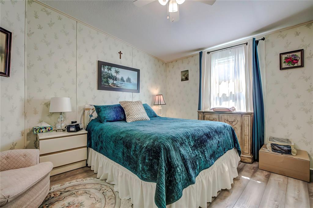 3307 Keye Drive Spring Hill, FL 34606 - Photo 27 of 29 a spacious bedroom with a bed and window