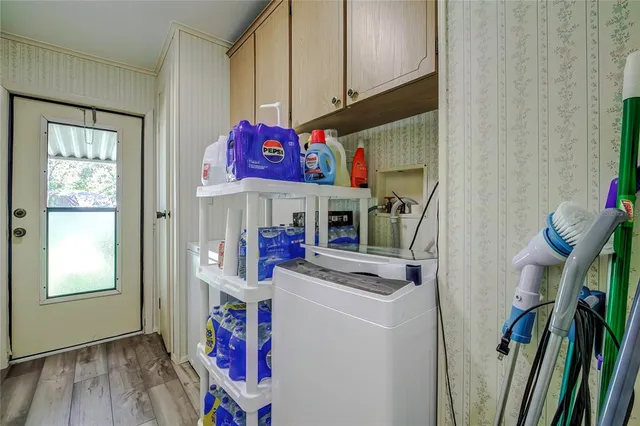 a view of water heater room with washer and dryer