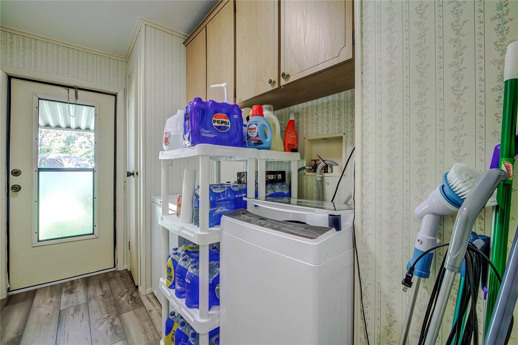 3307 Keye Drive Spring Hill, FL 34606 - Photo 10 of 29 a view of water heater room with washer and dryer