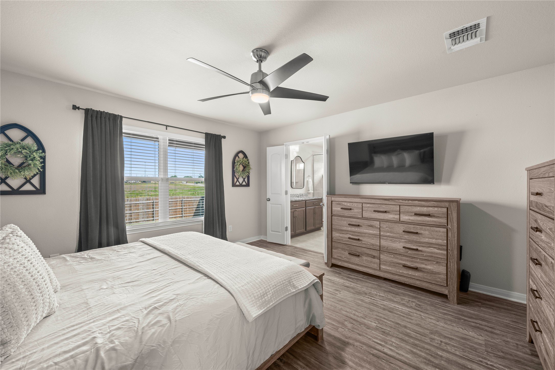 3018 Clevelander Drive Temple, TX 76504 - Photo 6 of 21 a bedroom with a bed and a flat screen tv