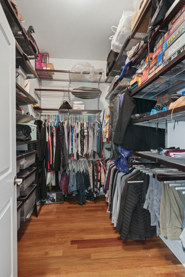 955 West Monroe Street, Unit 3C Chicago, IL 60607 - Photo 12 of 22 a view of walk in closet with clothes and shoes