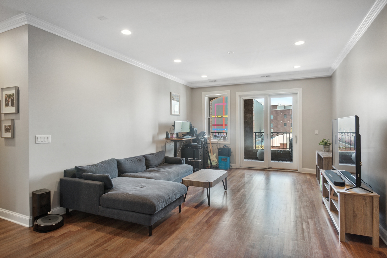 955 West Monroe Street, Unit 3C Chicago, IL 60607 - Photo 2 of 22 a living room with furniture a large window and wooden floor