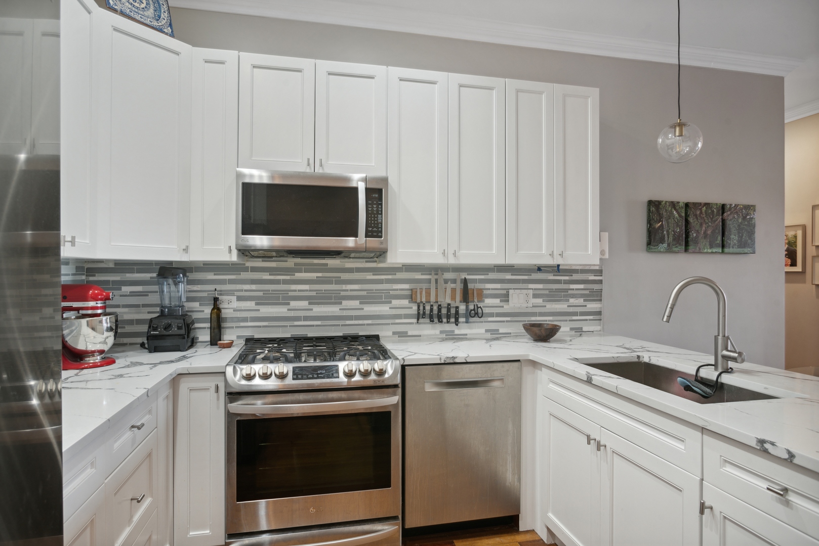 955 West Monroe Street, Unit 3C Chicago, IL 60607 - Photo 6 of 22 a kitchen with stainless steel appliances granite countertop a sink stove and cabinets