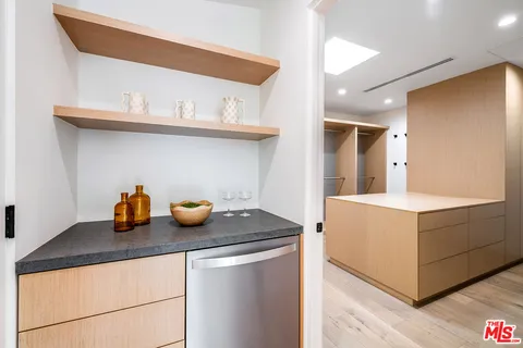 a kitchen with a sink a stove and cabinets
