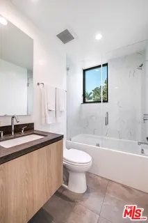 a bathroom with a sink a toilet and a bathtub