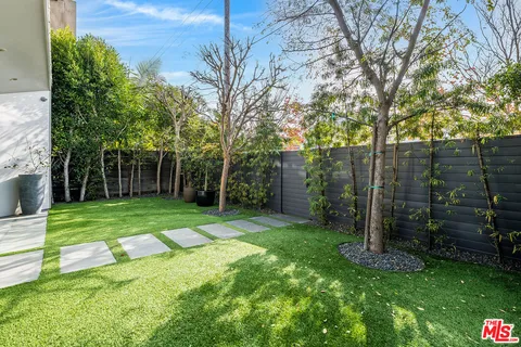 a view of a backyard with a garden