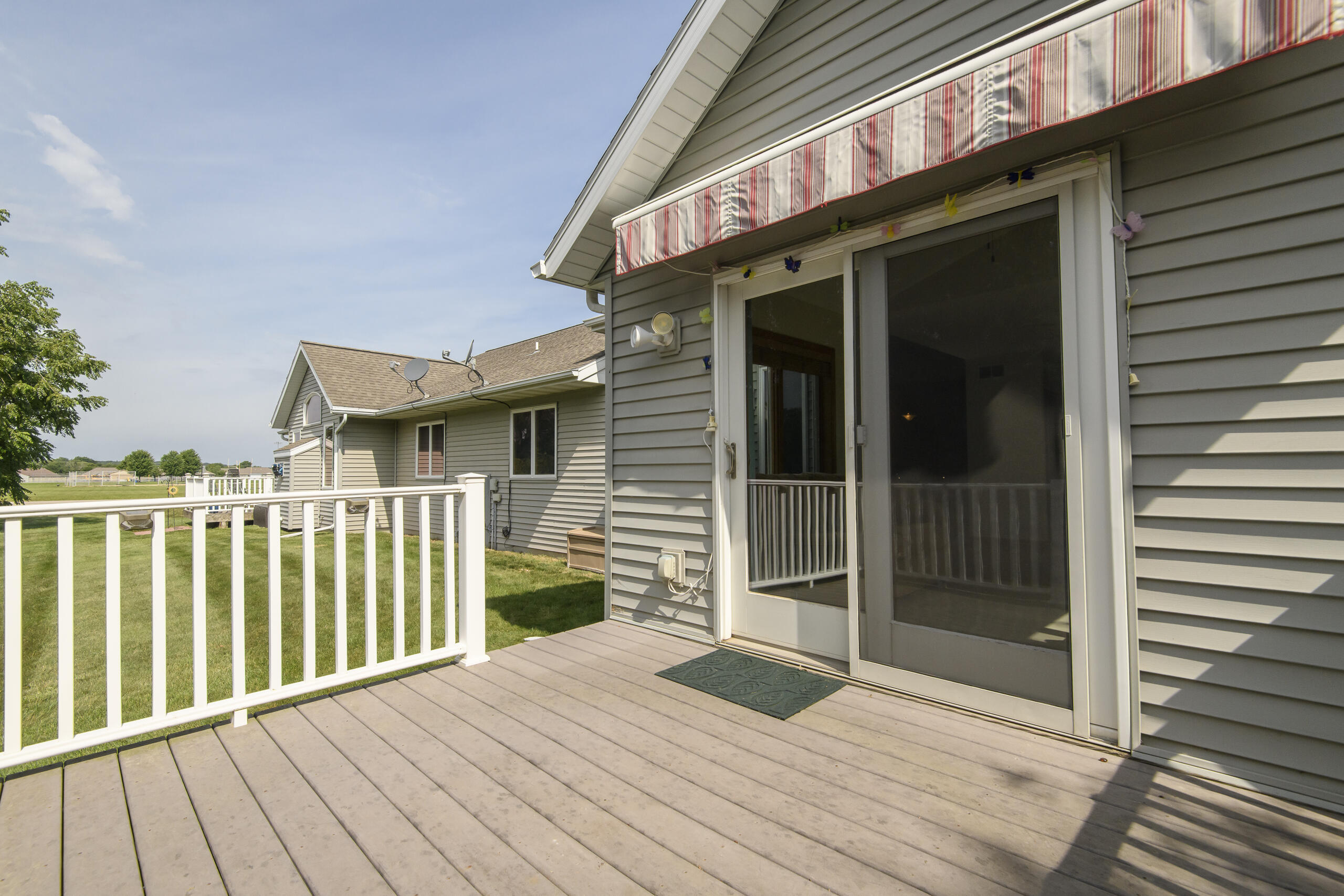 1610 Kyle Lane, Unit 28 Beloit, WI 53511 - Photo 26 of 35 Patio Doors to Maintenance Free Deck