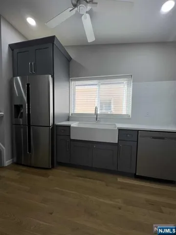 an empty room with a empty space and windows