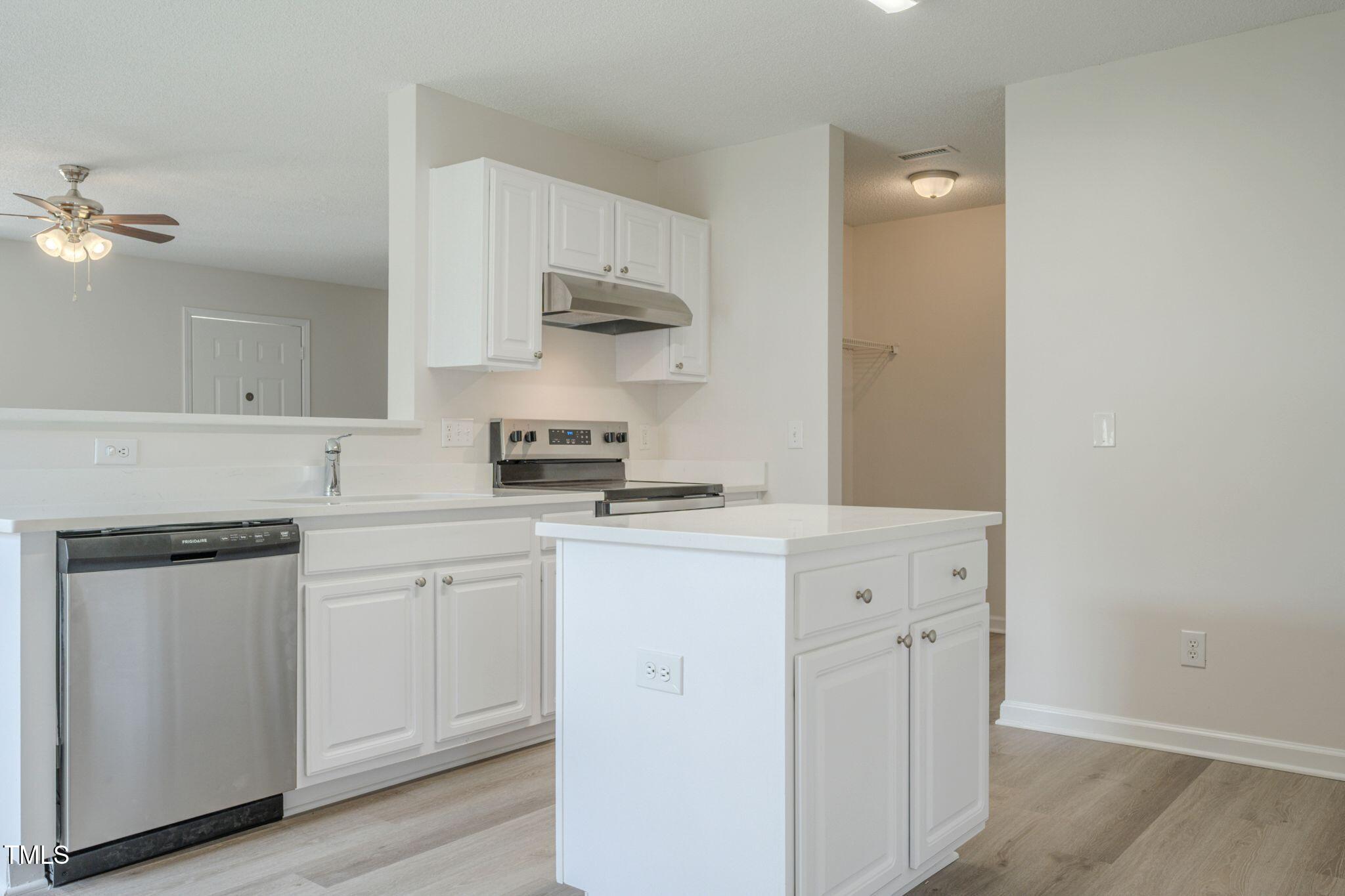 5522 Marthonna Way Raleigh, NC 27616 - Photo 6 of 21 a kitchen with cabinets appliances and a sink