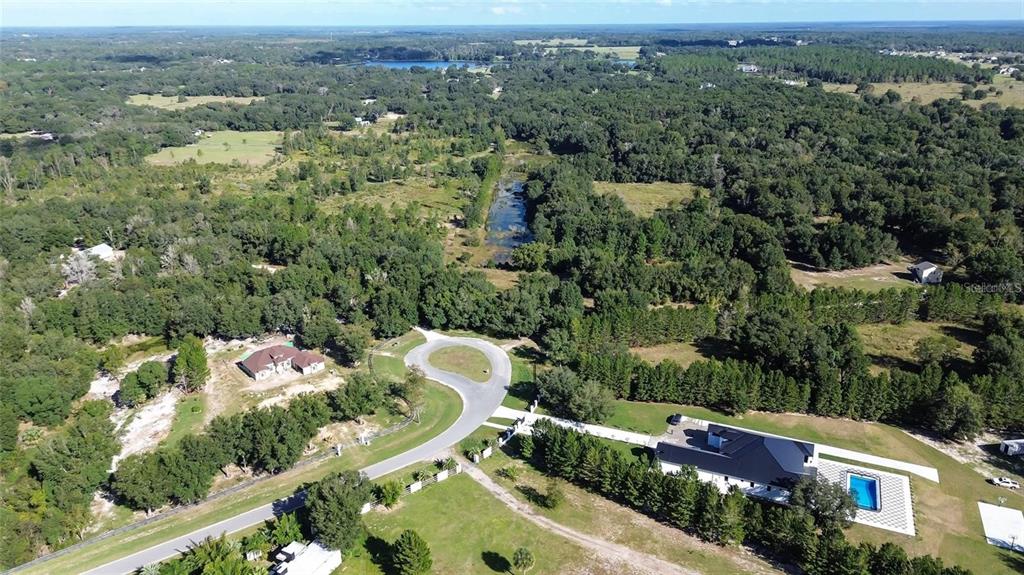 an aerial view of residential house with outdoor space