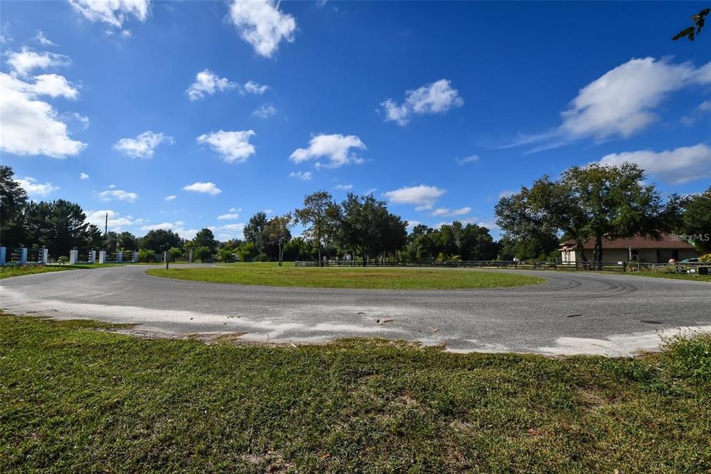 6 Tree Frog Lane Eustis, FL 32736 - Photo 17 of 19 a view of a golf course with a lake