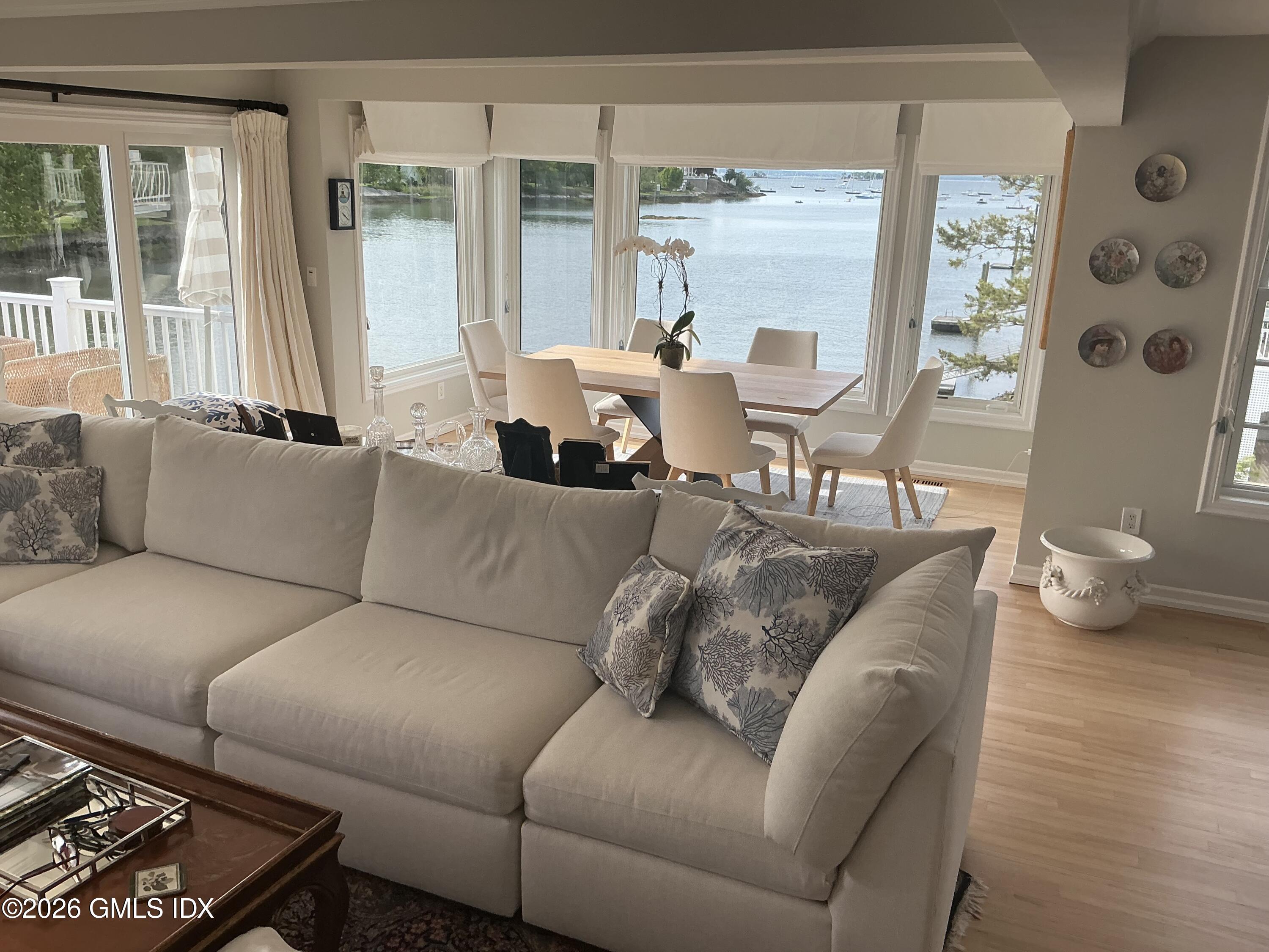 633 Steamboat Road, Unit 5 Greenwich, CT 06830 - Photo 29 of 29 a living room with furniture and a large window