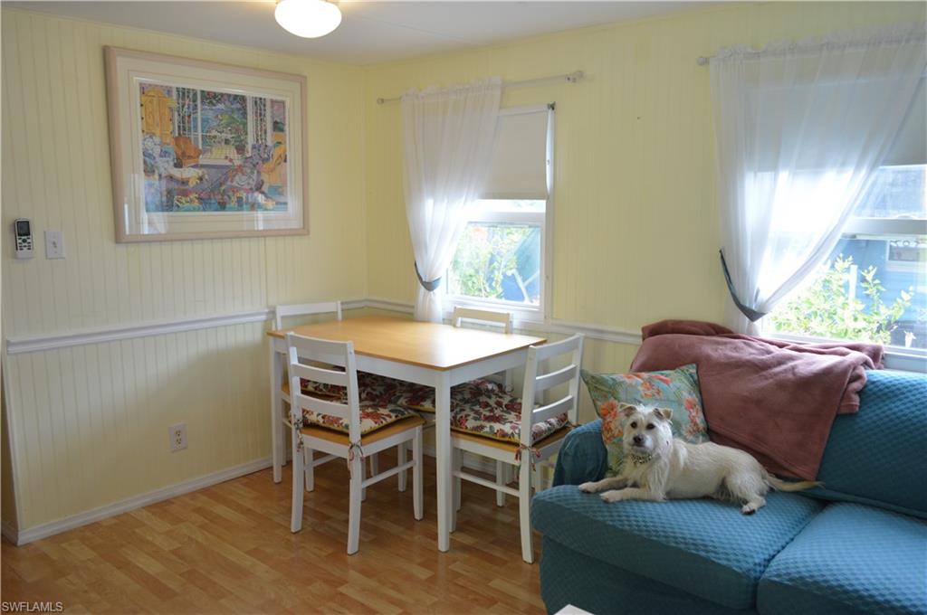 414 Papaya Street, Unit C Goodland, FL 34140 - Photo 5 of 13 a dining room with furniture and window