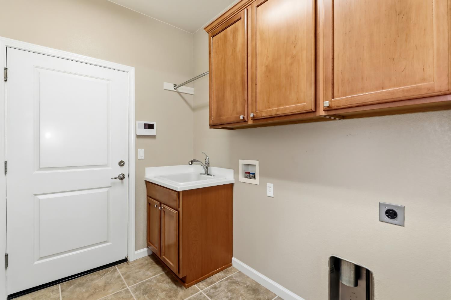 9644 Oakham Way Elk Grove, CA 95757 - Photo 38 of 77 Indoor laundry room. Loads of storage