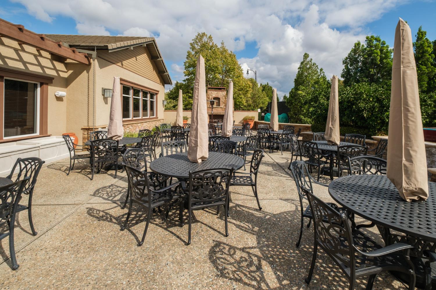 9644 Oakham Way Elk Grove, CA 95757 - Photo 46 of 77 dining and entertaining patio with outdoor fireplace at clubhouse