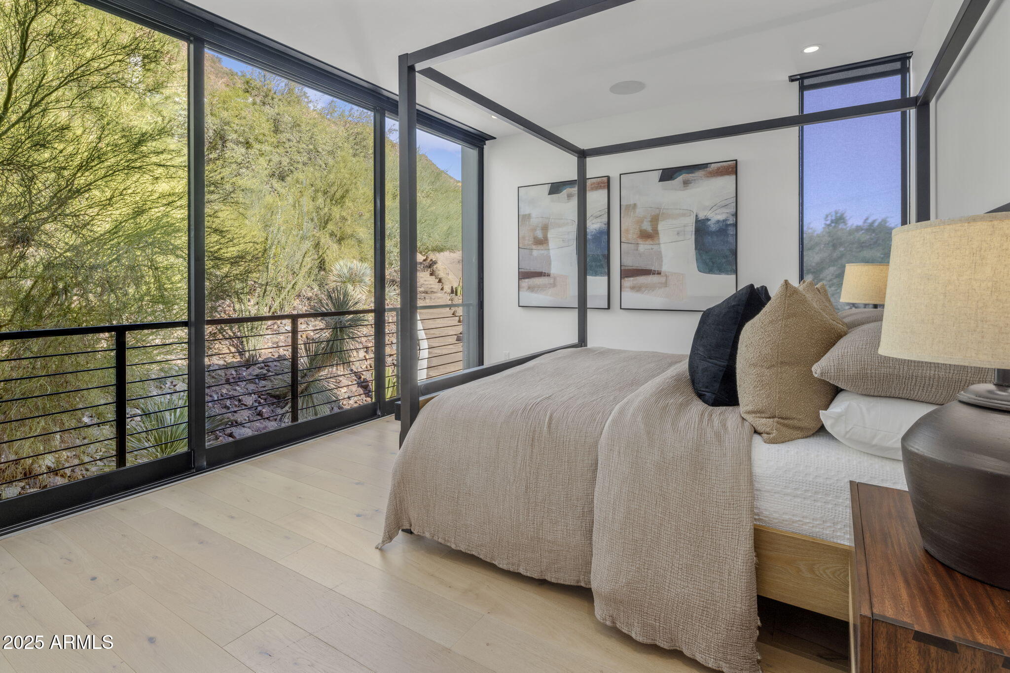 5419 East Valle Vista Road Phoenix, AZ 85018 - Photo 55 of 71 a bedroom with a bed and large window