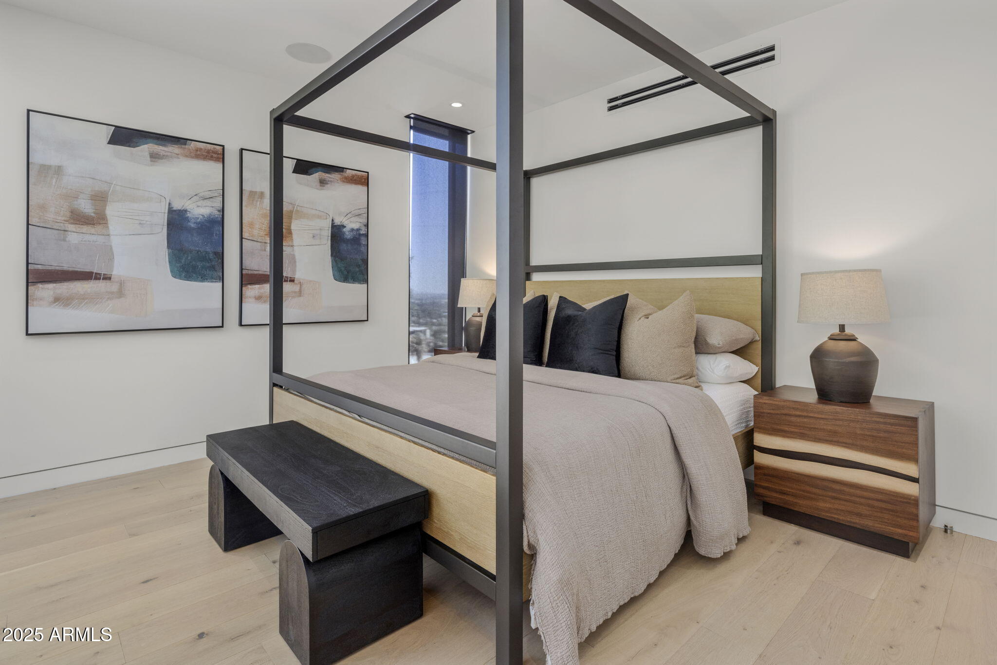 5419 East Valle Vista Road Phoenix, AZ 85018 - Photo 56 of 71 a bedroom with a bed and a painting on the wall