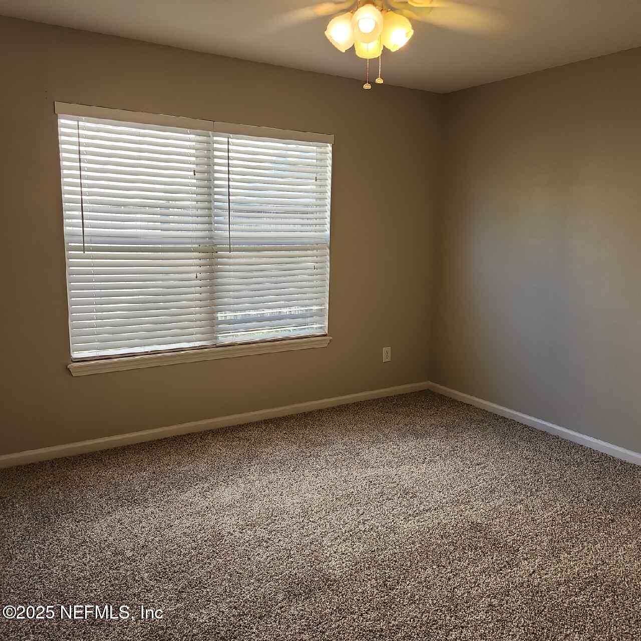 96203 Ridgewood Circle Fernandina Beach, FL 32034 - Photo 12 of 20 an empty room with a window