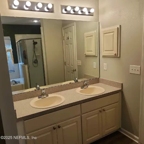 a bathroom with a sink and a mirror