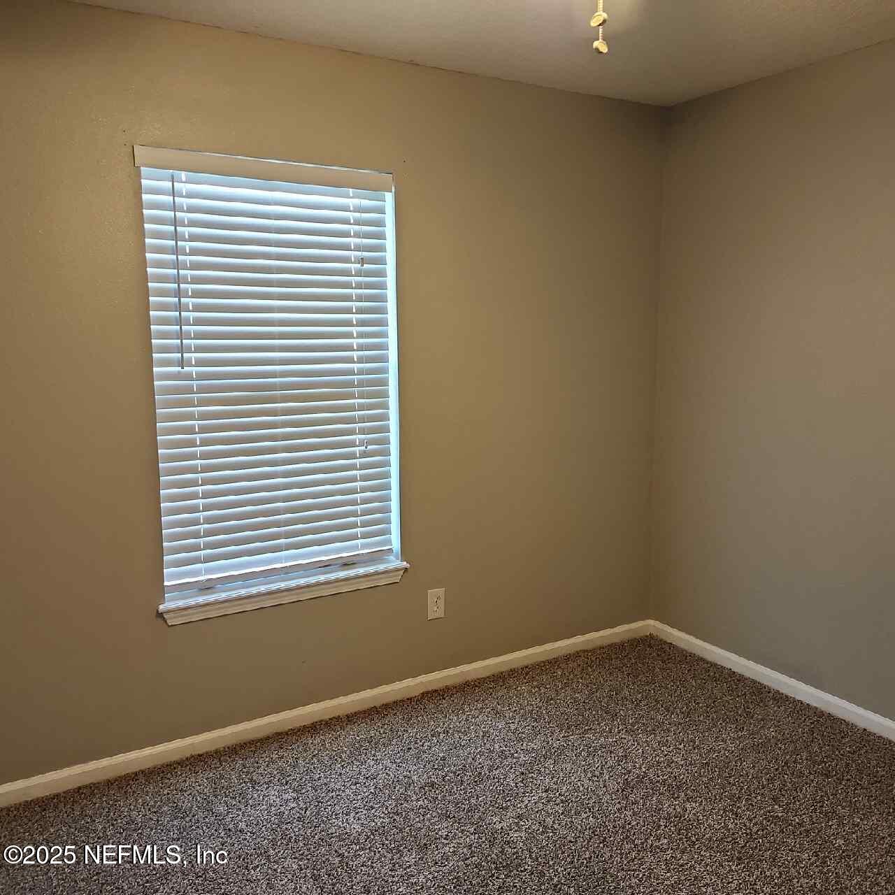 96203 Ridgewood Circle Fernandina Beach, FL 32034 - Photo 15 of 20 an empty room with a window