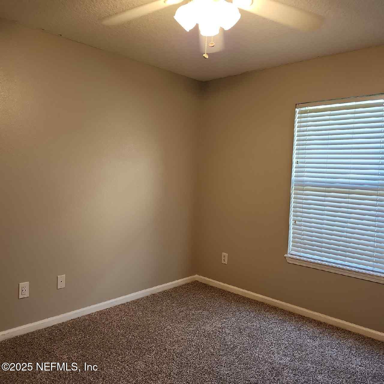 96203 Ridgewood Circle Fernandina Beach, FL 32034 - Photo 17 of 20 an empty room with a window