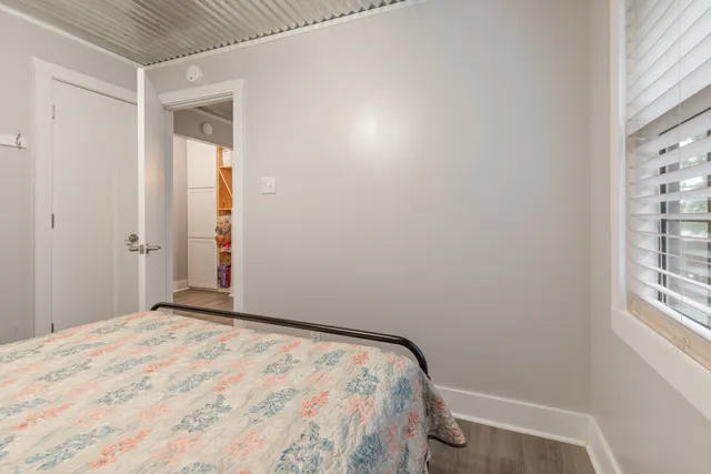 a view of a house with a yard from a lake view