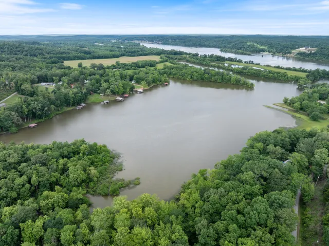a view of a house with backyard porch and sitting area