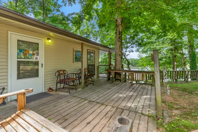 an aerial view of a residential houses with outdoor space and lake view