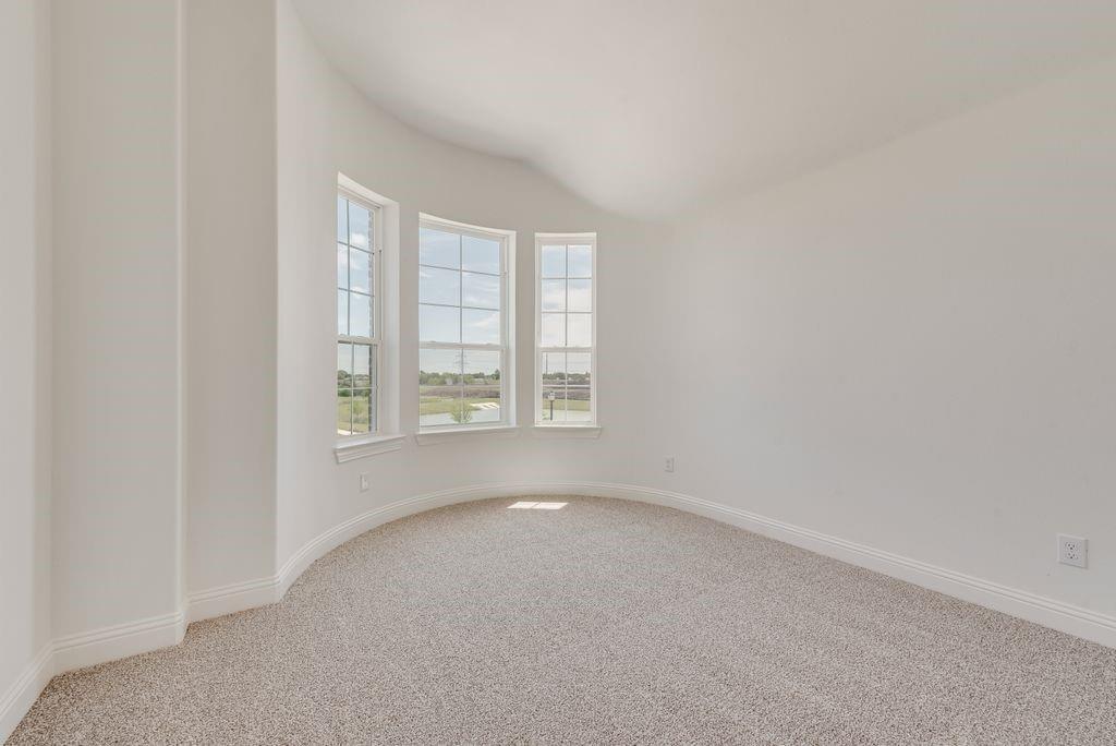 248 Golden Run Drive Fate, TX 75189 - Photo 19 of 34 an empty room with windows
