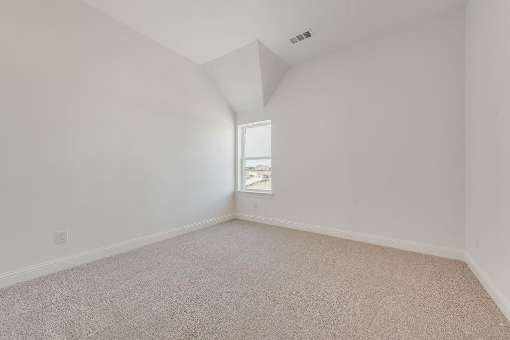 248 Golden Run Drive Fate, TX 75189 - Photo 23 of 34 a view of an empty room and window