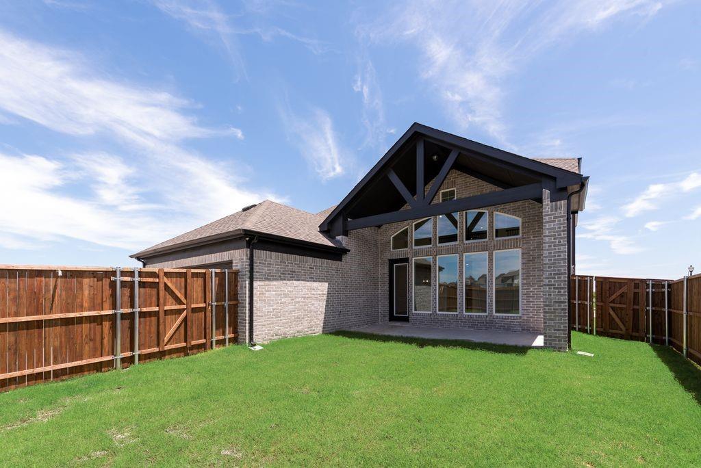 248 Golden Run Drive Fate, TX 75189 - Photo 25 of 34 a view of backyard of house with wooden deck and barbeque oven