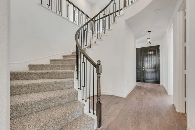 a view of staircase with white walls and white walls