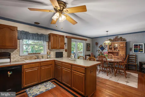 a kitchen with a sink appliances and a counter top space