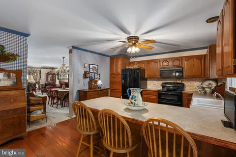 a kitchen with a table and chairs