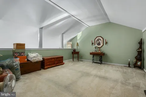 a bathroom with a sink vanity mirror and toilet