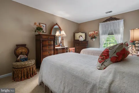 a view of a livingroom with workspace and a couch