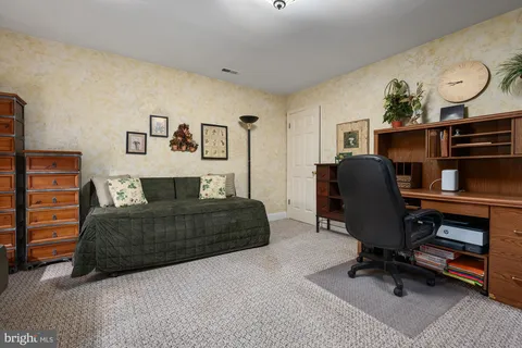 a bathroom with a sink a toilet and shower curtain