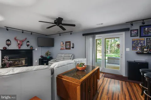 a view of a house with a yard and sitting area