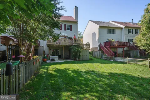a view of a porch with furniture and a potted plant