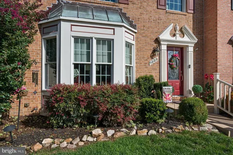 a picture of a bench in front of a wall